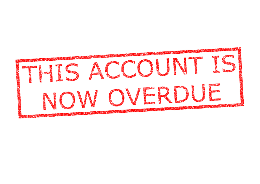 Red "this account is now overdue" stamp on white background