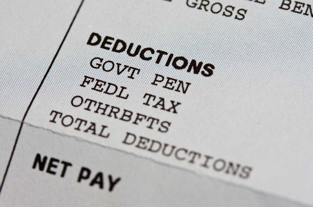 Close up of tax deductions on paycheck