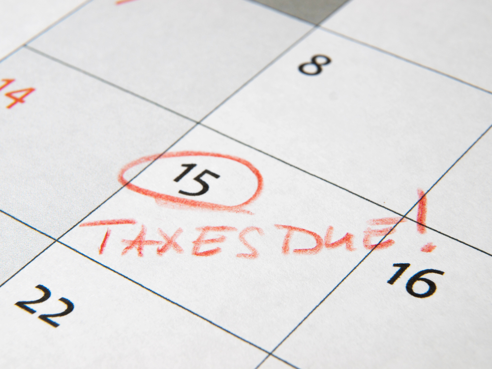 Calendar showing 15 circled and "taxes due" written in red