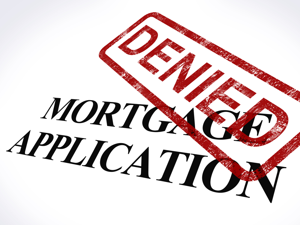 Red "denied" stamp on top of mortgage application