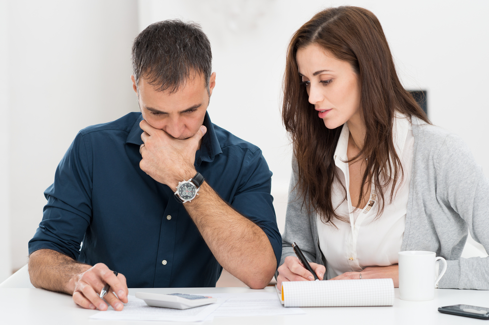 Worried couple going over finances