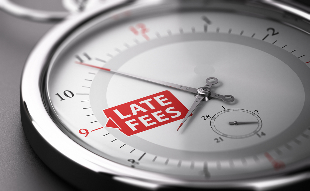 Closeup of pocket watch that reads "late fees"